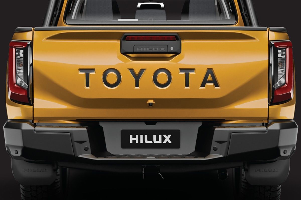 Toyota Hilux — Muscular tailgate with embossed TOYOTA lettering and LED tail lamps.