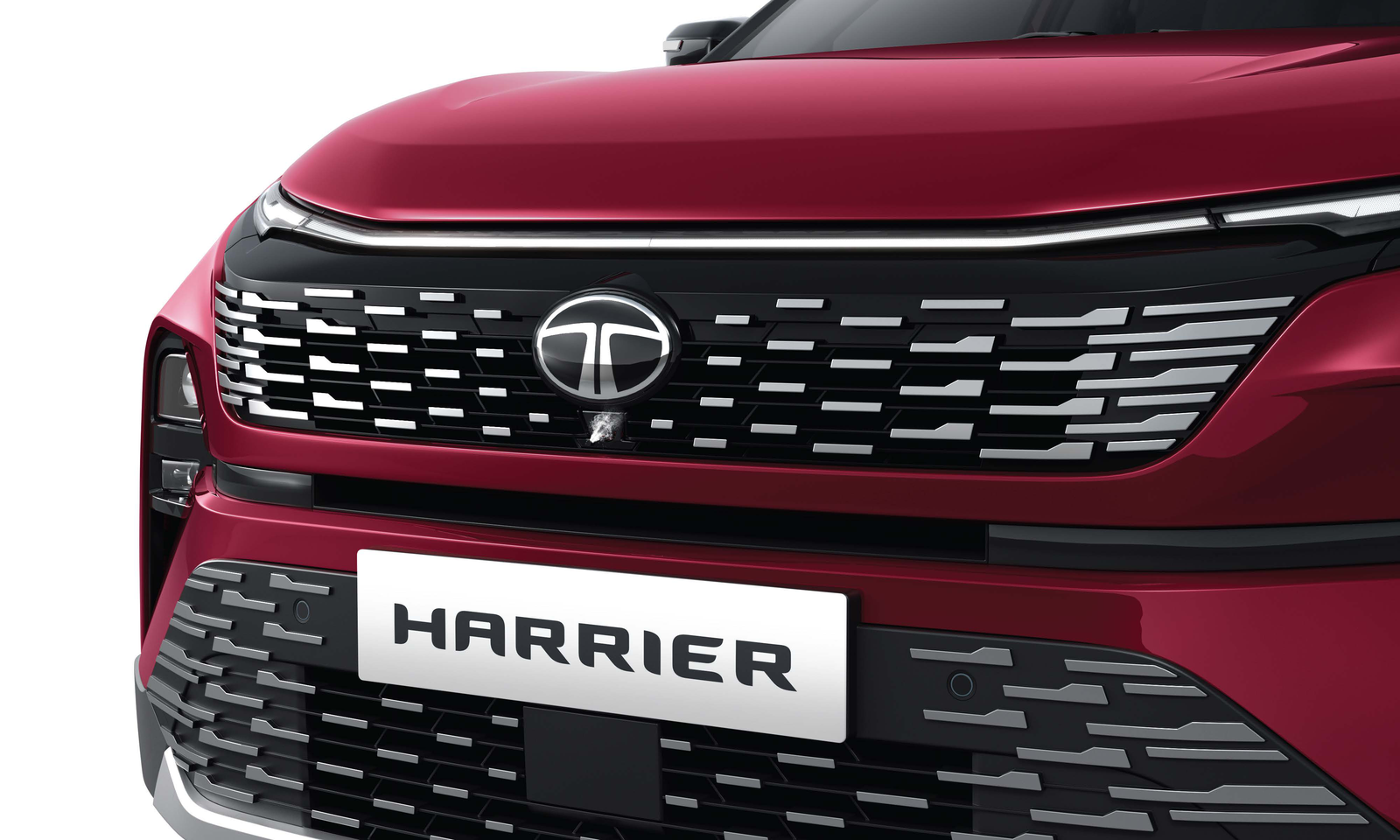 Tata Harrier — Bold front grille with tri-arrow detailing and a full-width LED light strip