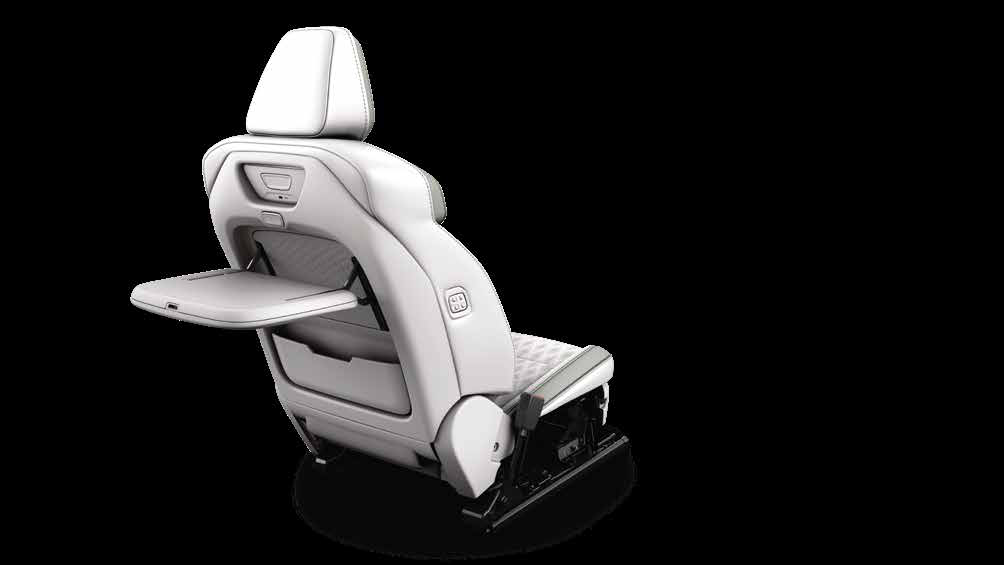 Mahindra XEV 9S — Front seat-back tray table for second-row occupants