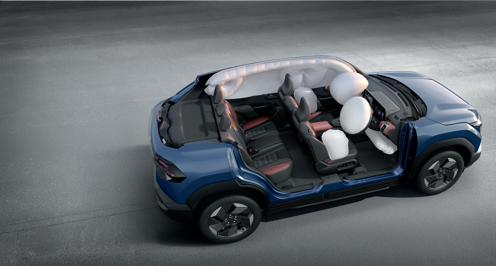 Maruti Suzuki e Vitara — Six-airbag cutaway showing front, side and full-length curtain airbags deployed across both rows.