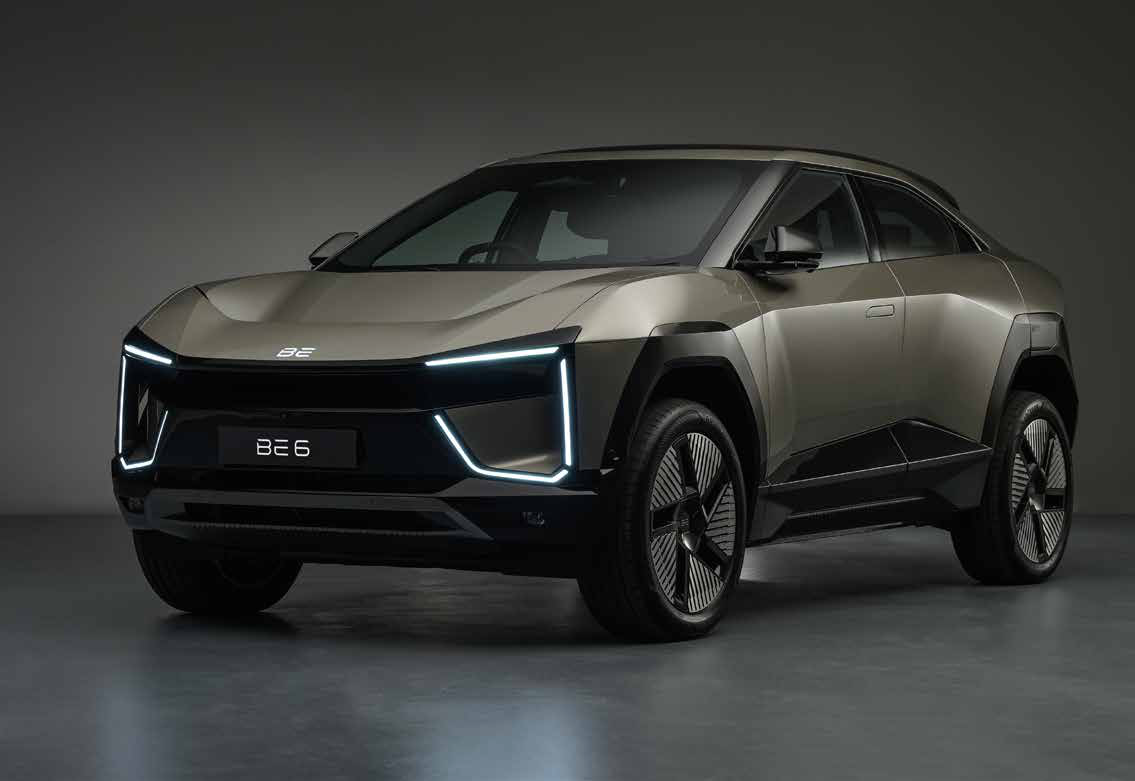 Mahindra BE 6 — Sporty coupe-SUV stance with sculpted, aerodynamic surfaces, seen in Desert Myst