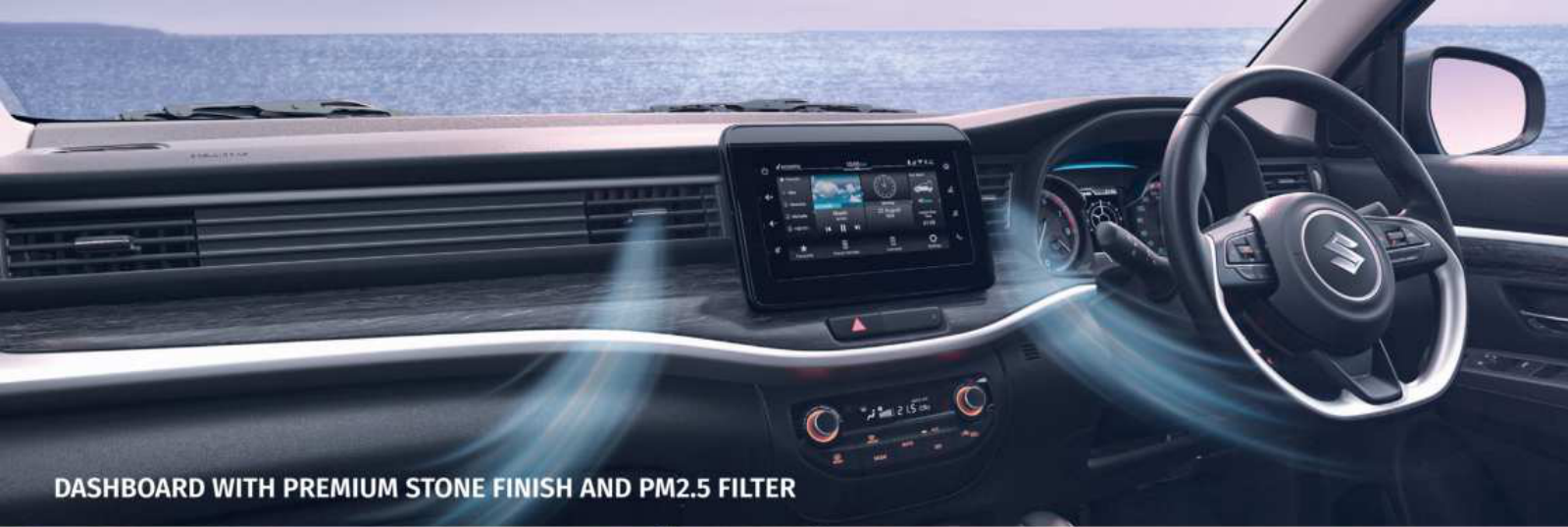 Maruti Suzuki XL6 — Sculpted dashboard in premium stone finish with a floating touchscreen and PM2.5 cabin filter