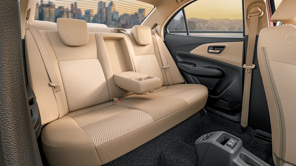 Maruti Suzuki Dzire — Dual-tone fabric rear seat with fold-down centre armrest and cup holders